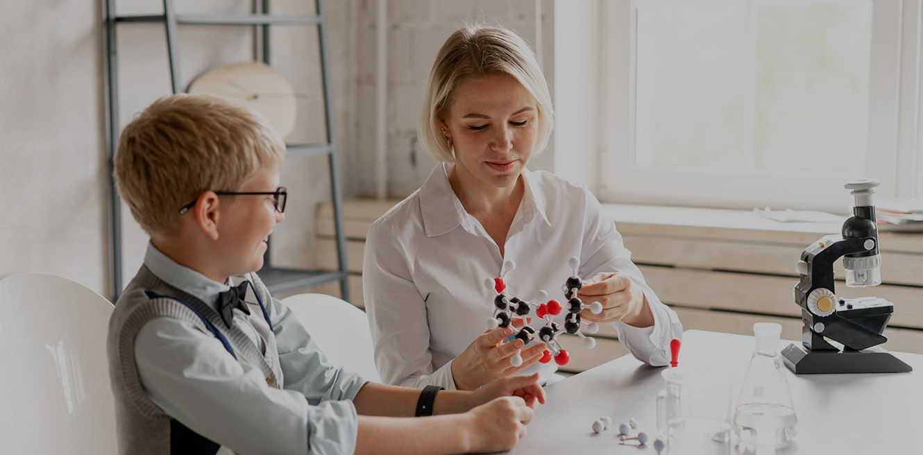 Female science tutor in Simi Valley studying chemistry with student